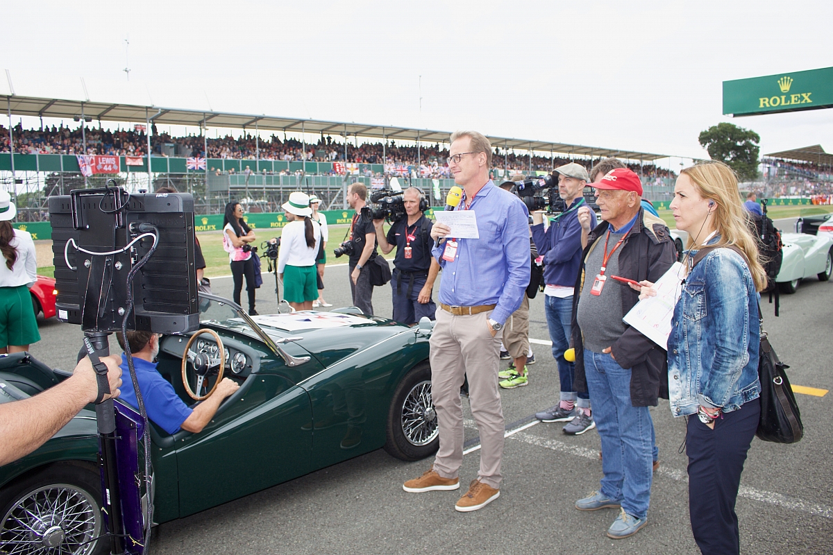 nikki-lauder-and-the-worlds-press-admire-the-trs-on-the-grid-while-thery-await-the-drivers-procession-1200x800.jpg?v20240716173043